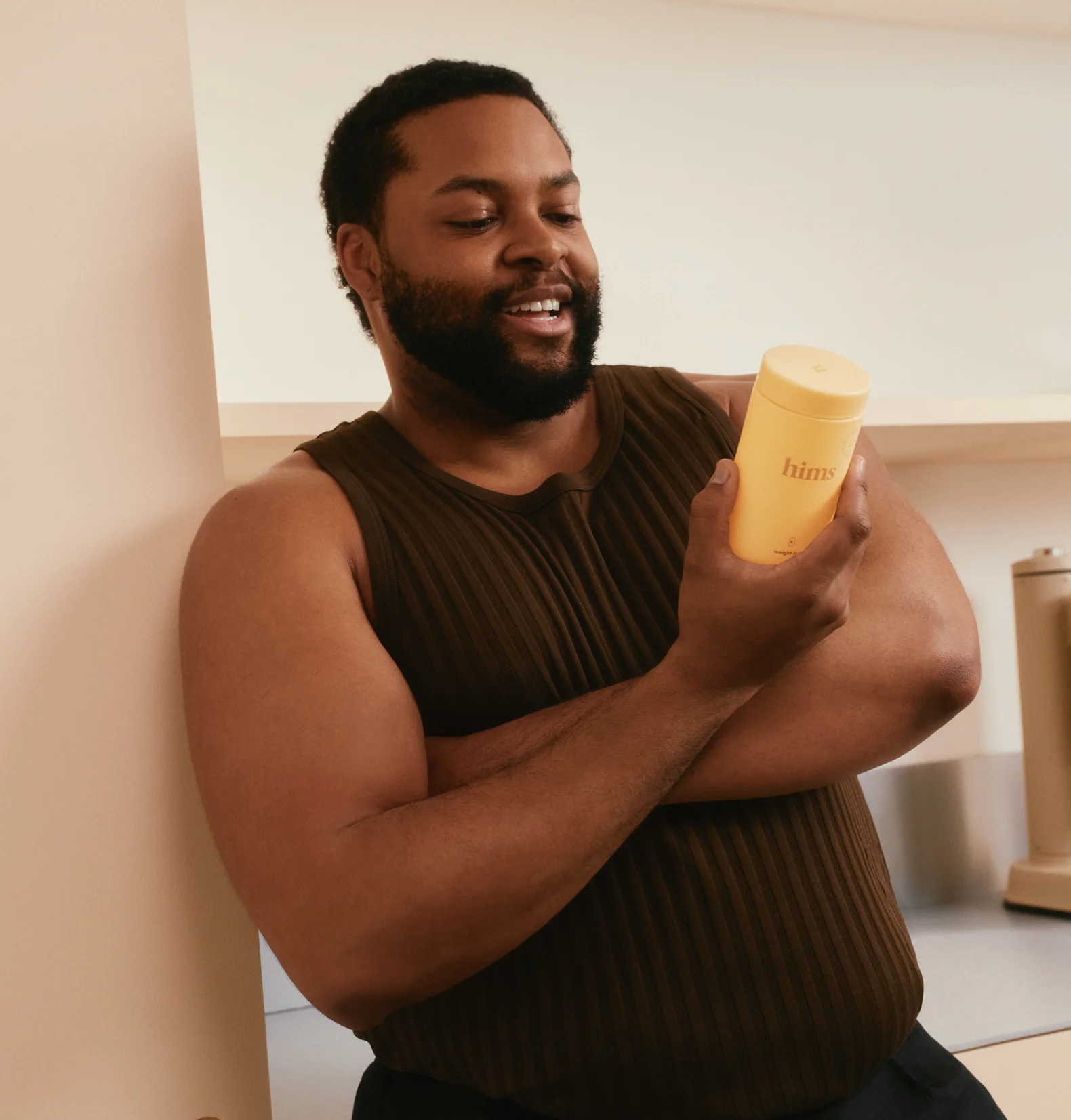 Man holding Hims weight loss medication